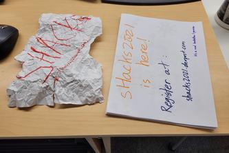 Stack of sHacks posters